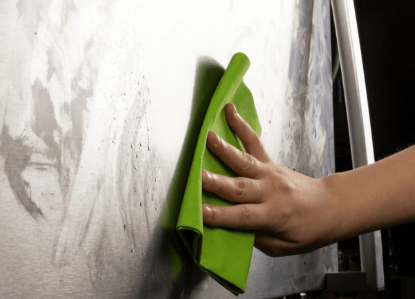 Green UltimateCloth wiping fridge