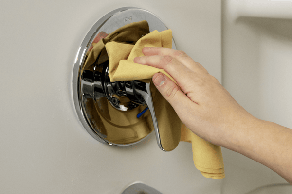 UltimateCloth PRO Cloth wiping a shower handle